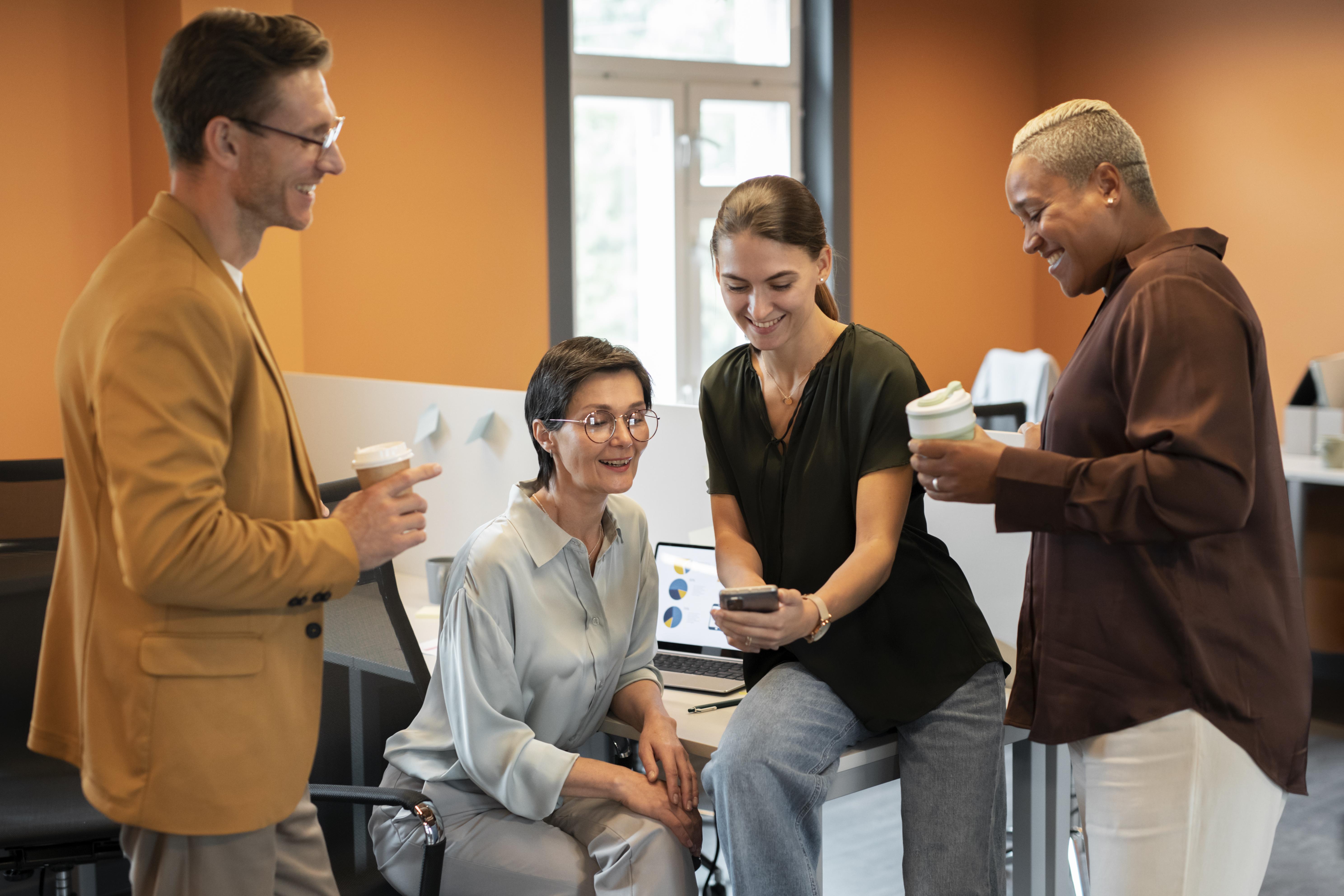 people talking and relaxed in the workplace